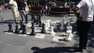 A game of chess between a group men for all to see
